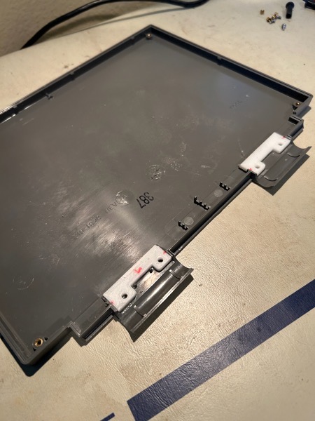 PowerBook 170 display with printed repair standoffs.