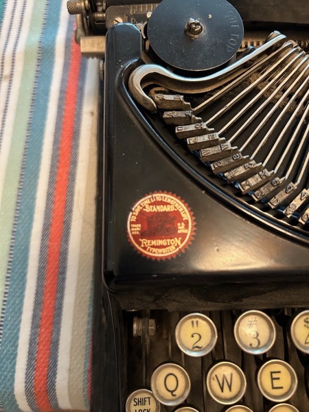 Close up view of Remington Portable typewriter with the basket lifted.