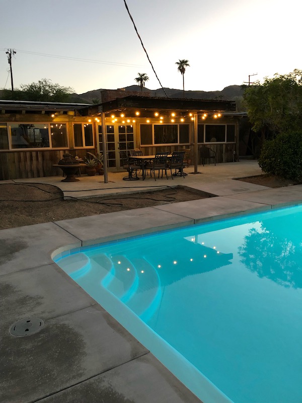 Backyard photo with pool.